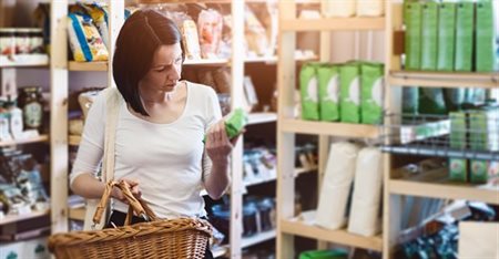 Woman reading food label